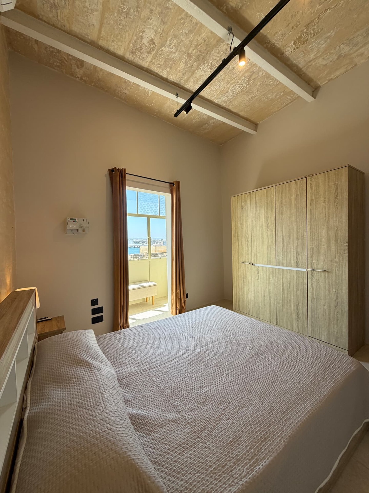 Comfortable double bedroom with natural light