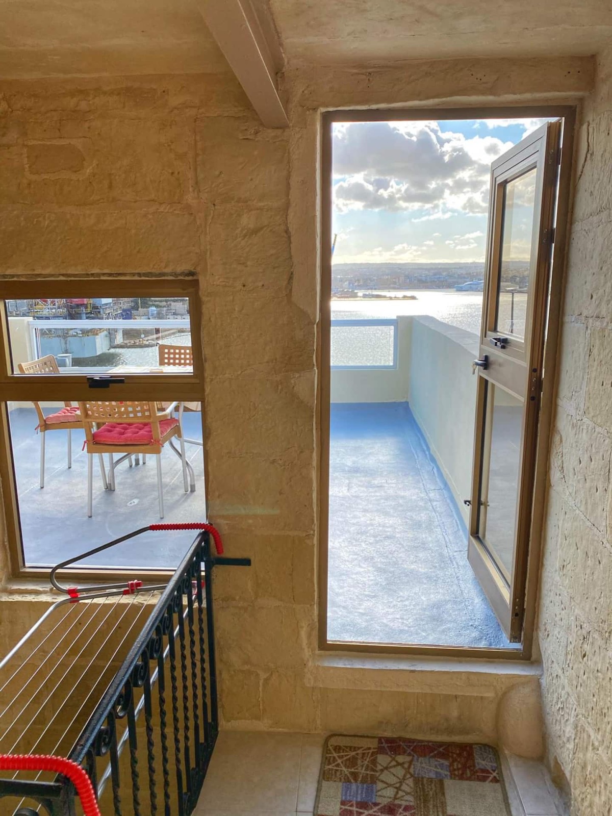 Roof terrace seating area with harbour views in Senglea, Malta
